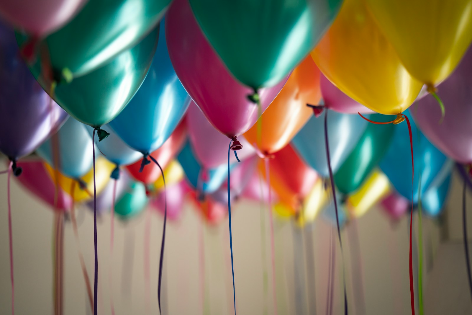 selective focus photography of assorted-color balloons