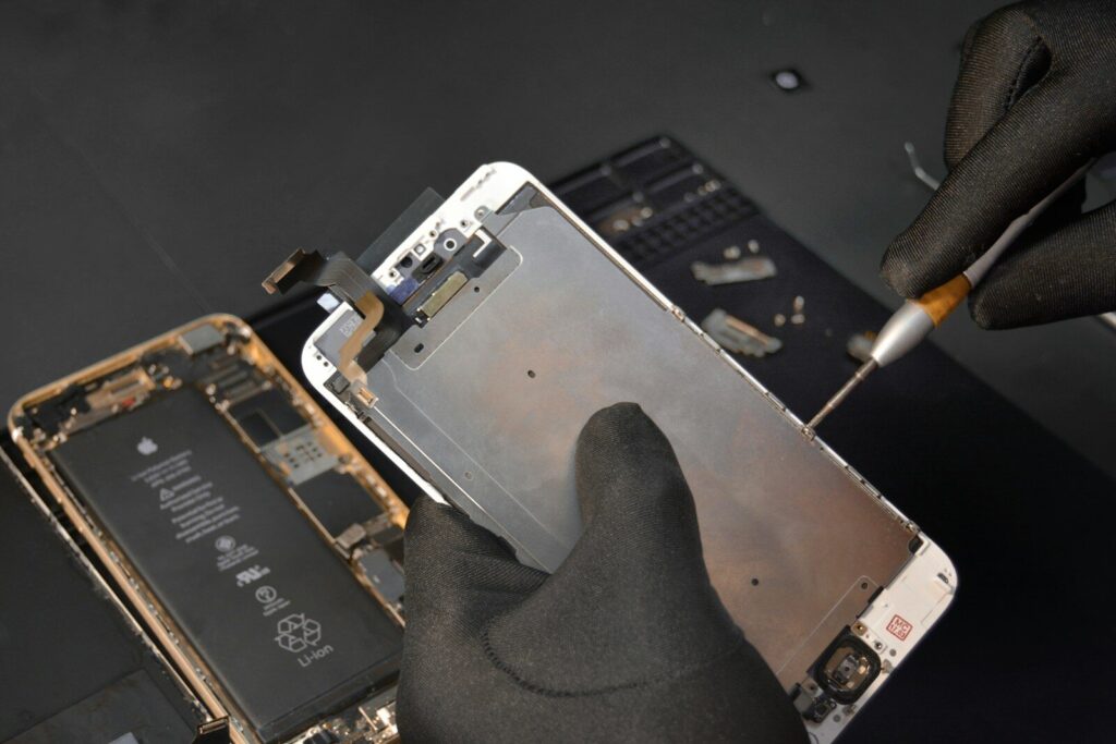 person fixing phone