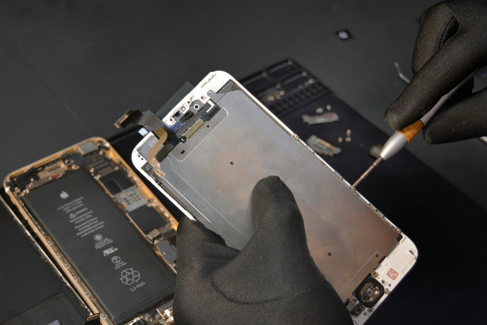 person fixing phone